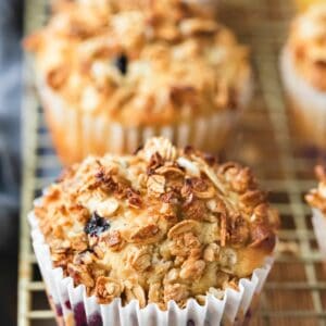 granola muffins on a gold wire cooling rack