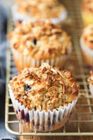 granola muffins on a gold wire cooling rack