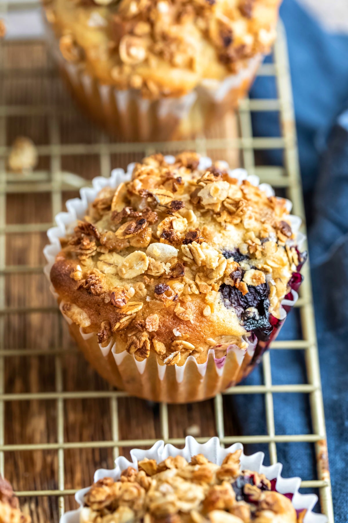 Granola muffin next to a blue linen napkin