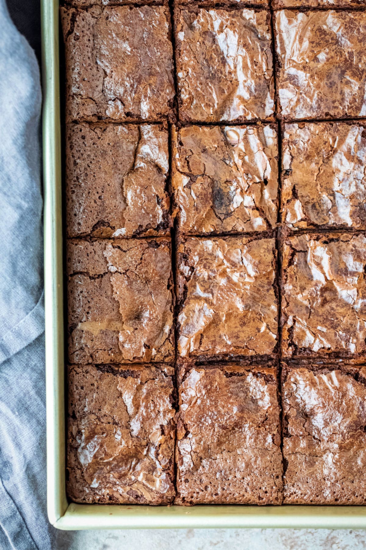 One-Bowl Brownie Recipe Brownies in a gold metal baking pan.