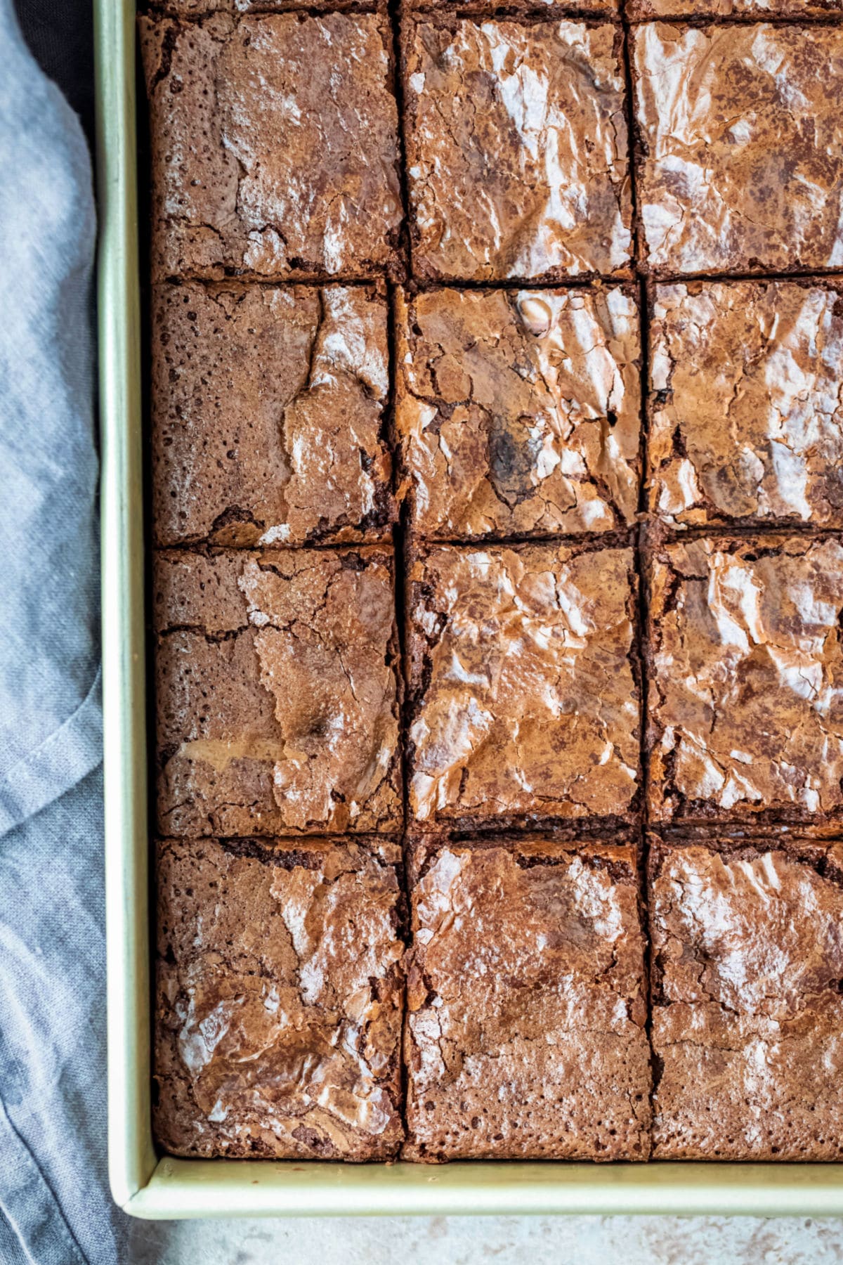 Brownies in a gold metal baking pan.