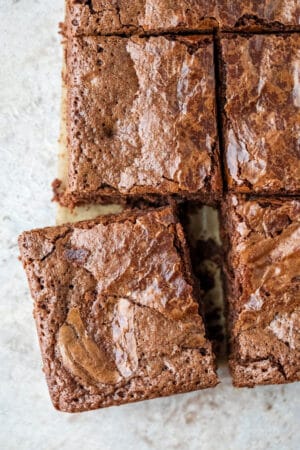 One brownie cut and slightly pulled away from the rest of the brownies