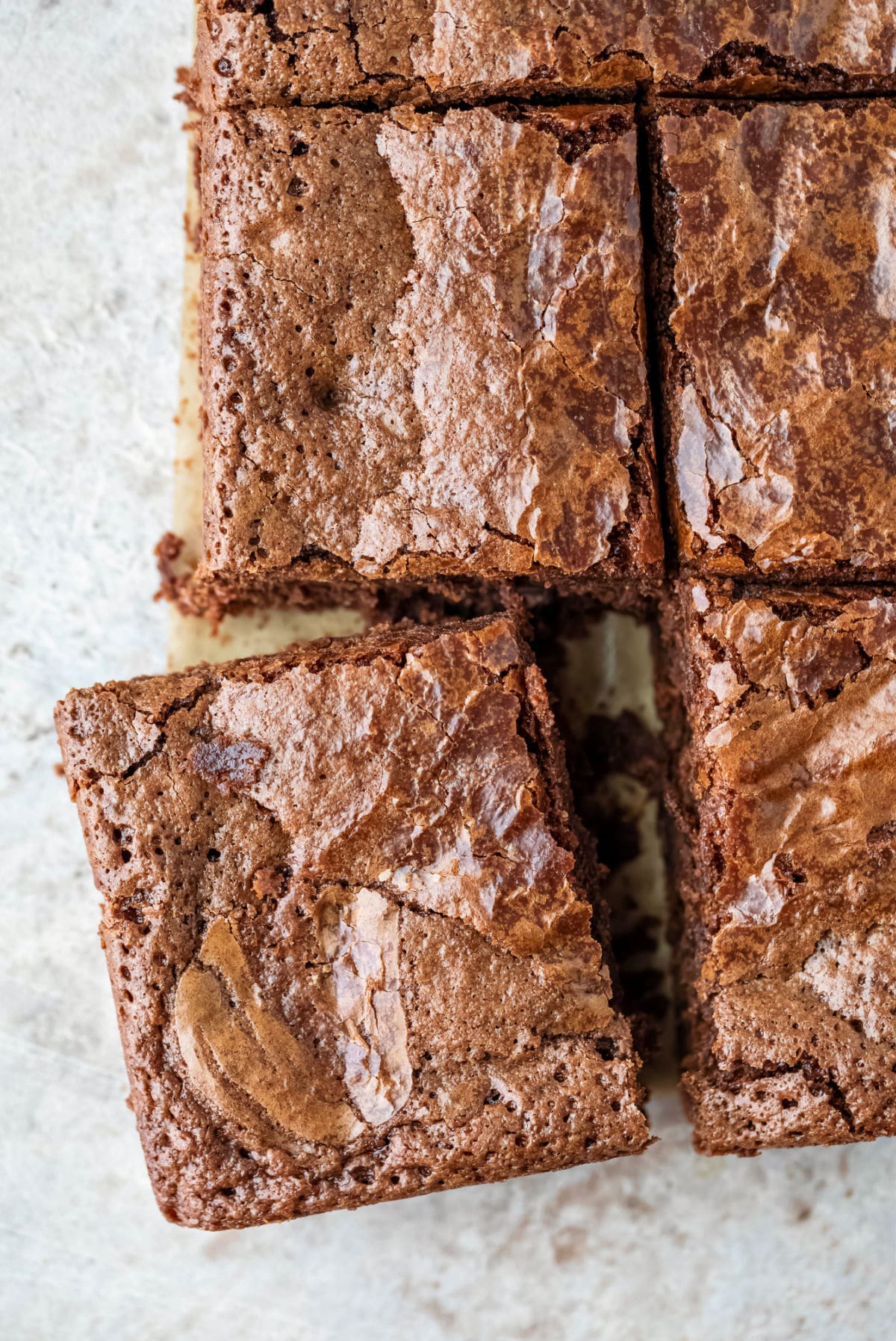 One brownie cut and slightly pulled away from the rest of the brownies.