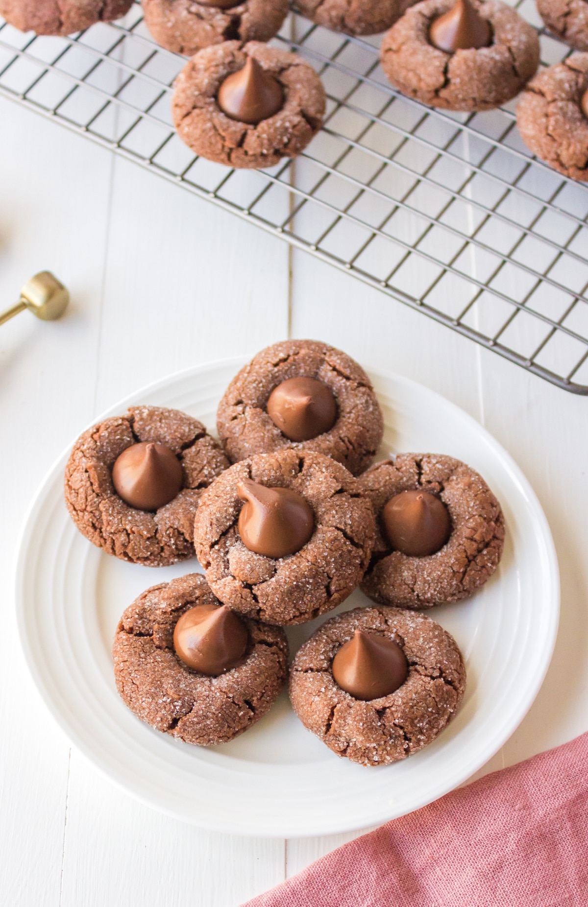 White plate with chocolate kiss cookies on it