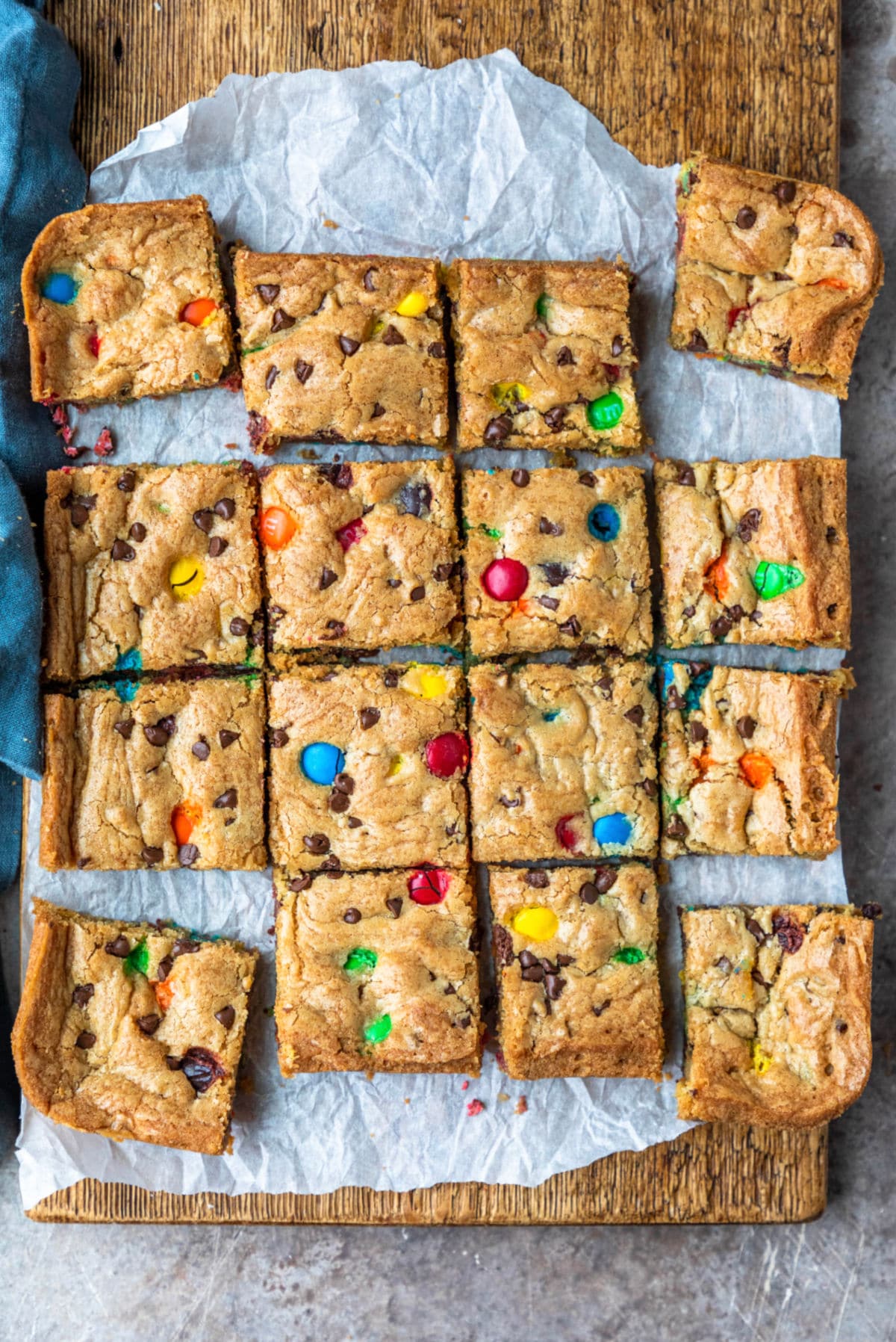 M&M cookie bars on a piece of parchment paper