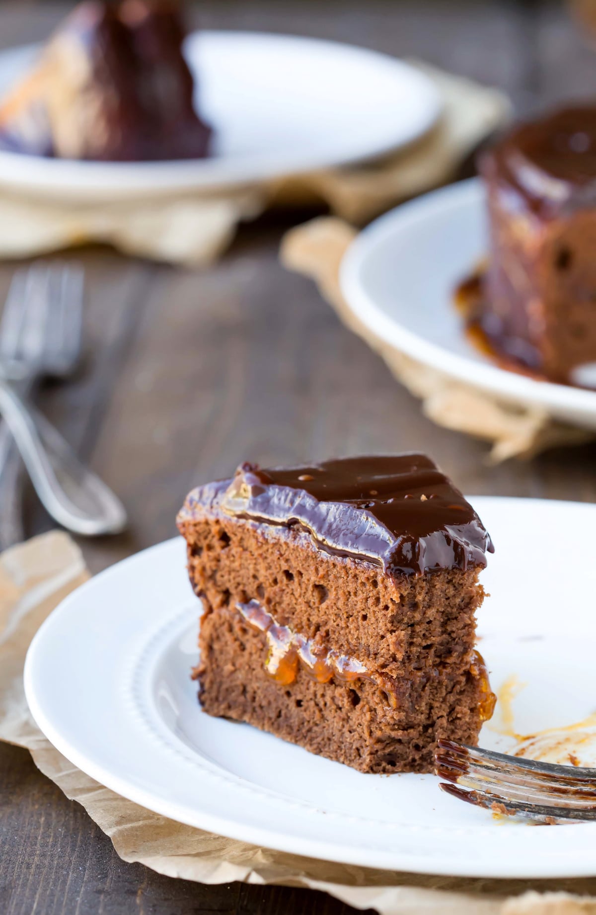 slice of Sacher Torte on a plate with a bite missing 