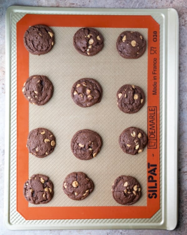 baked chocolate peanut butter cookies on a cookie sheet