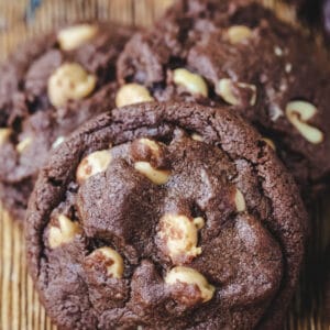 Chocolate peanut butter cookies on a wooden cutting board