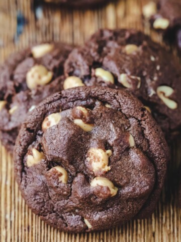 Chocolate peanut butter cookies on a wooden cutting board