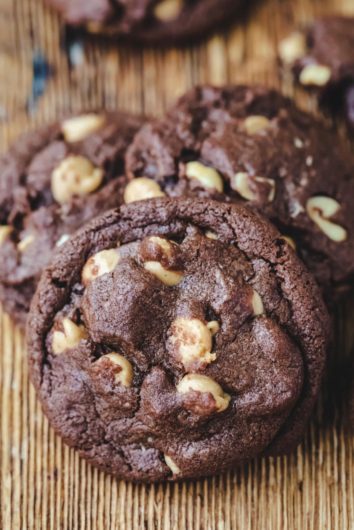 Chocolate peanut butter cookies on a wooden cutting board