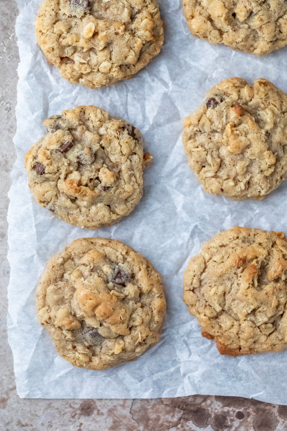 six lactation cookies on a piece of parchment paper