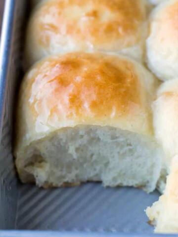 Roll missing from a pan of Amish dinner rolls.