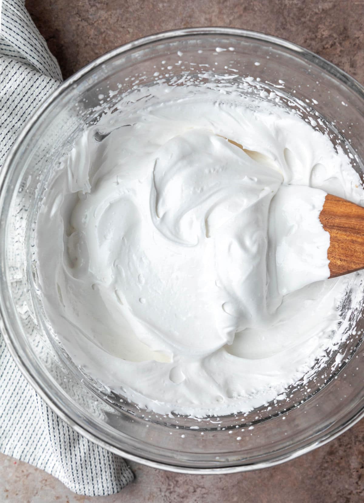 A glass bowl filled with seven minute frosting.