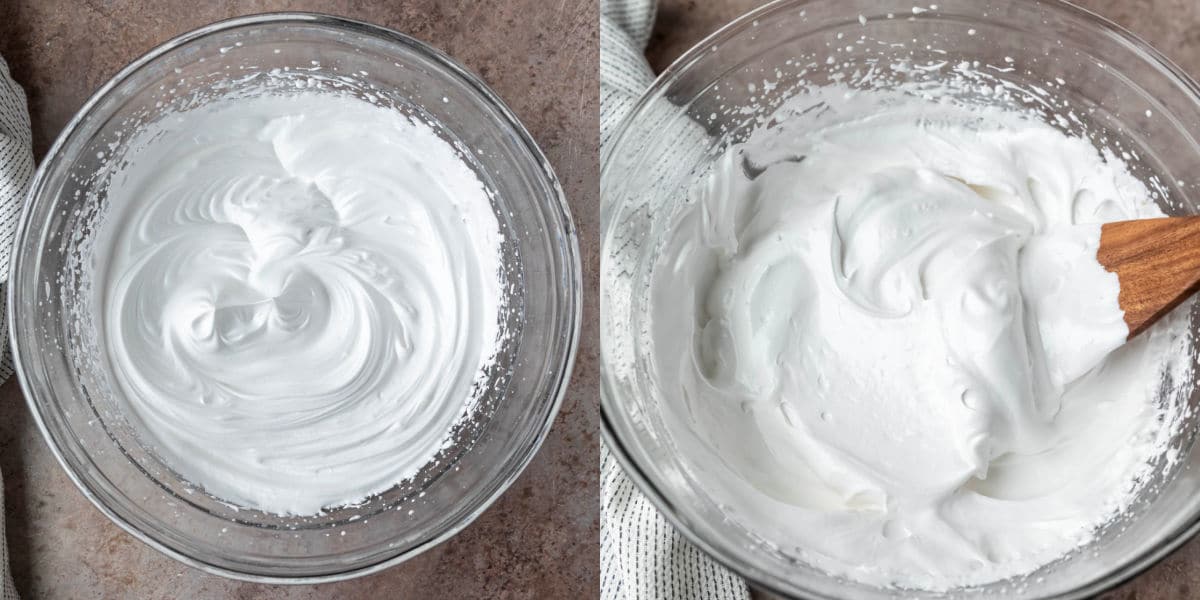Whipped egg whites in a glass mixing bowl.