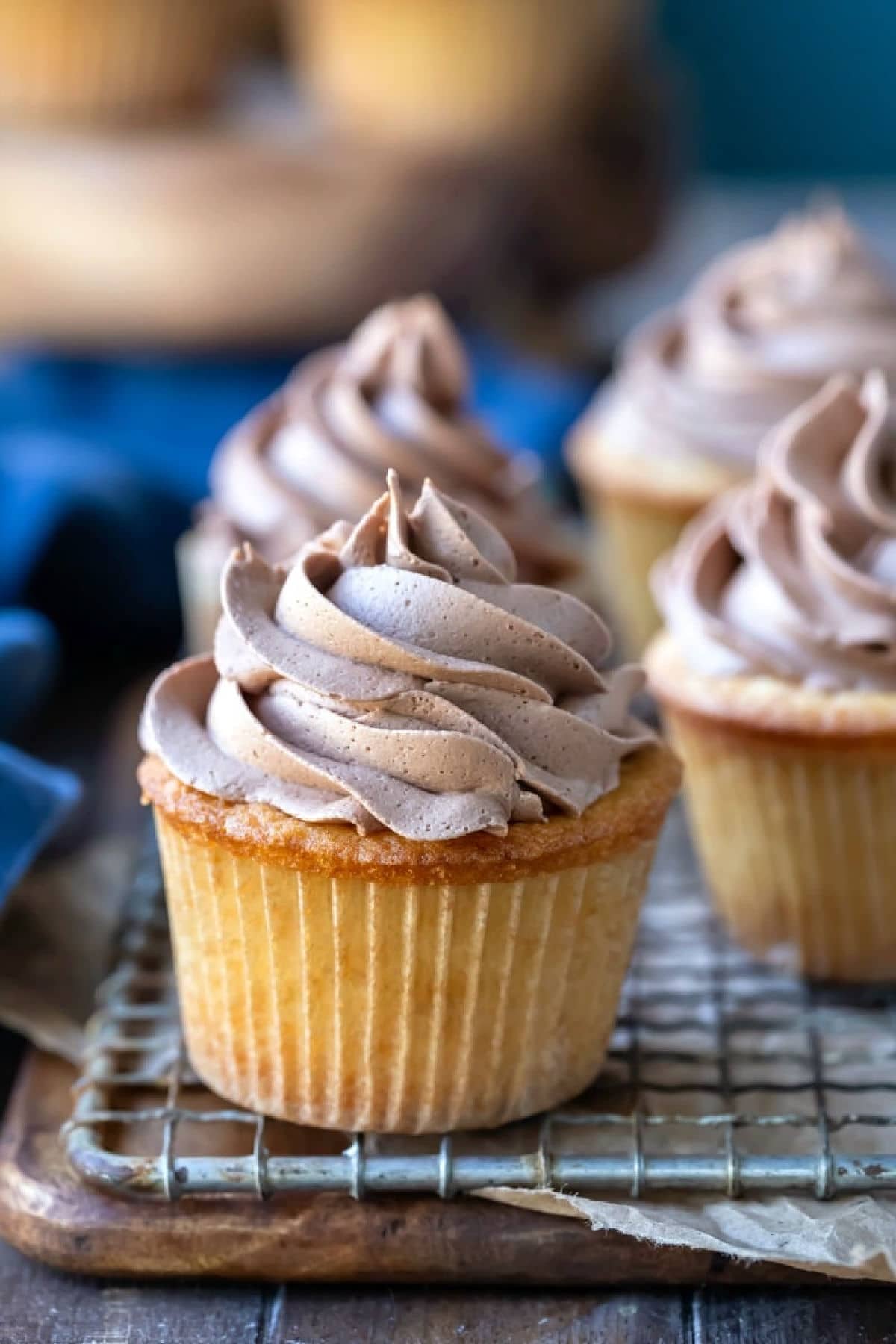 Chocolate buttercream frosting on yellow cupcakes. 