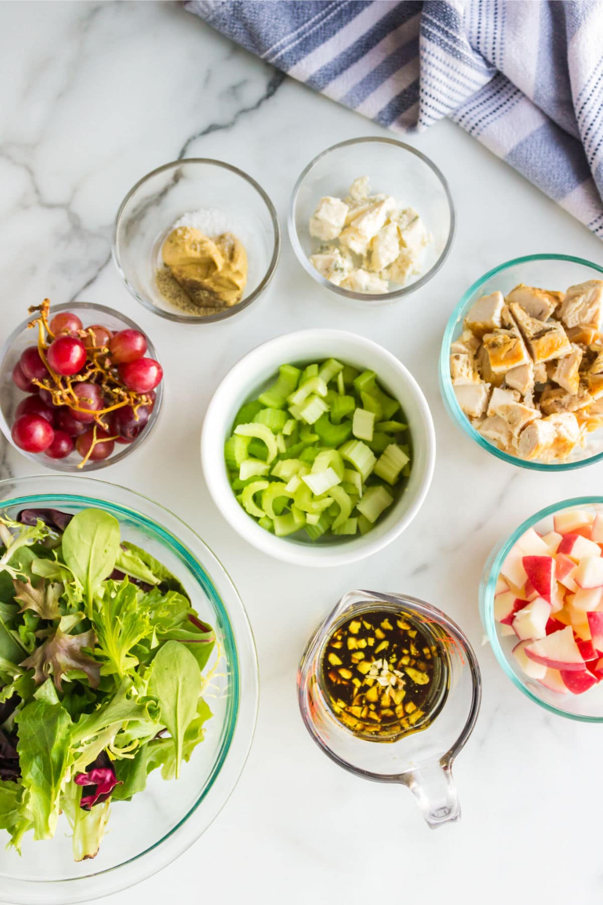 Waldorf salad ingredients on a marble background. 