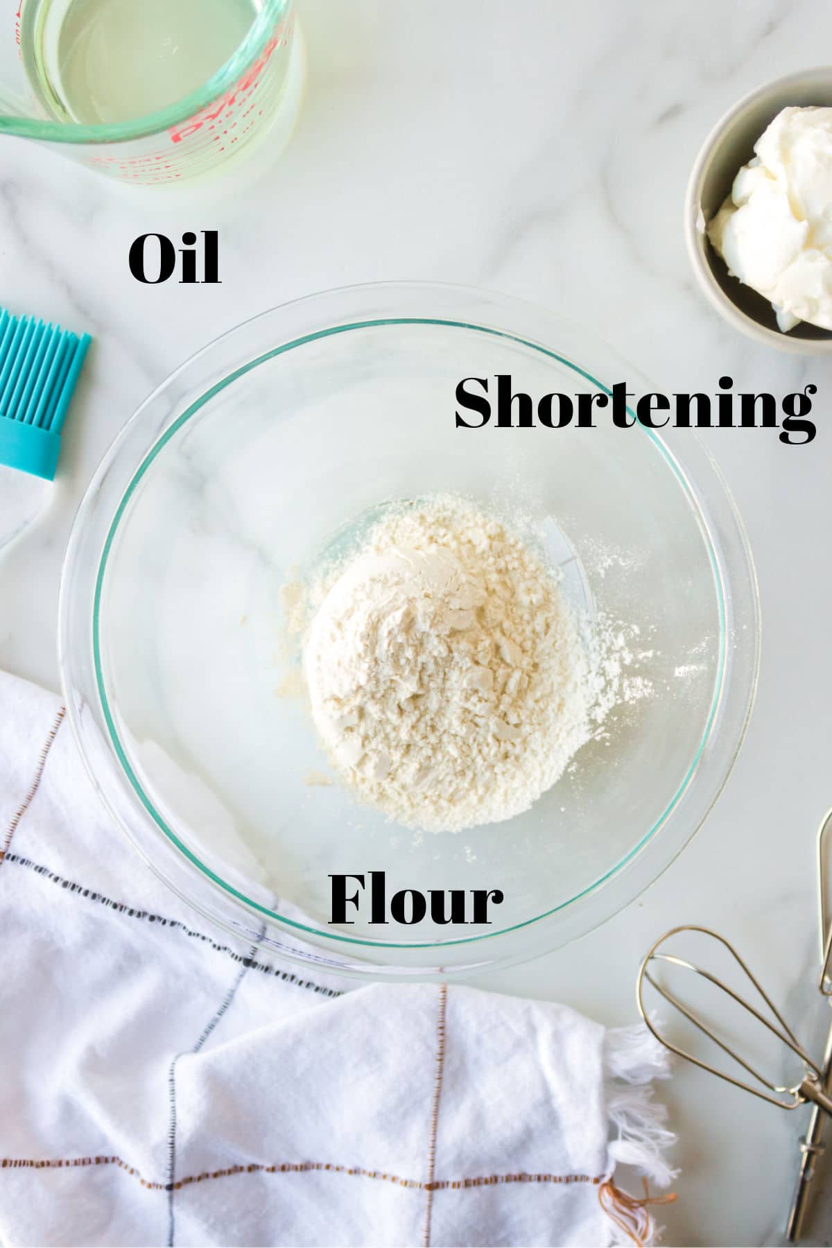 Photo of oil shortening and flour in dishes with labels. 