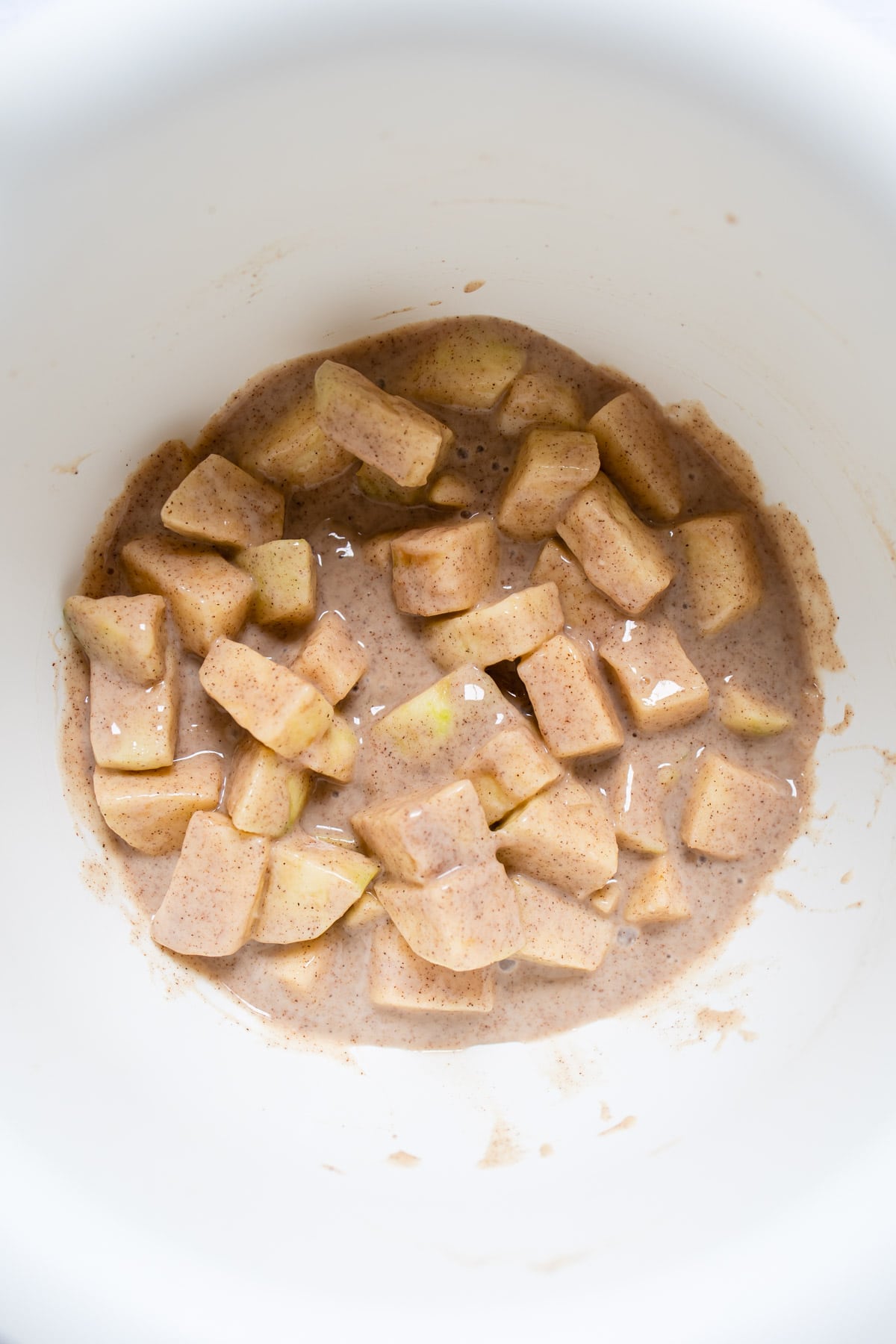 sour cream apple pie filling in a mixing bowl.