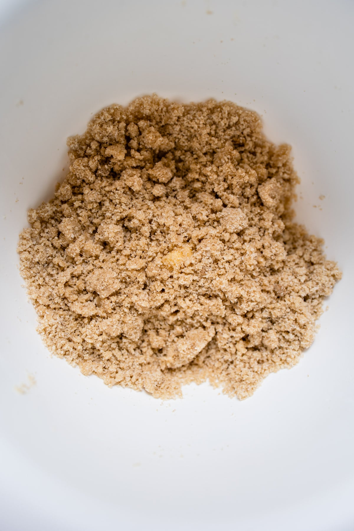 apple crumb pie topping in a mixing bowl. 
