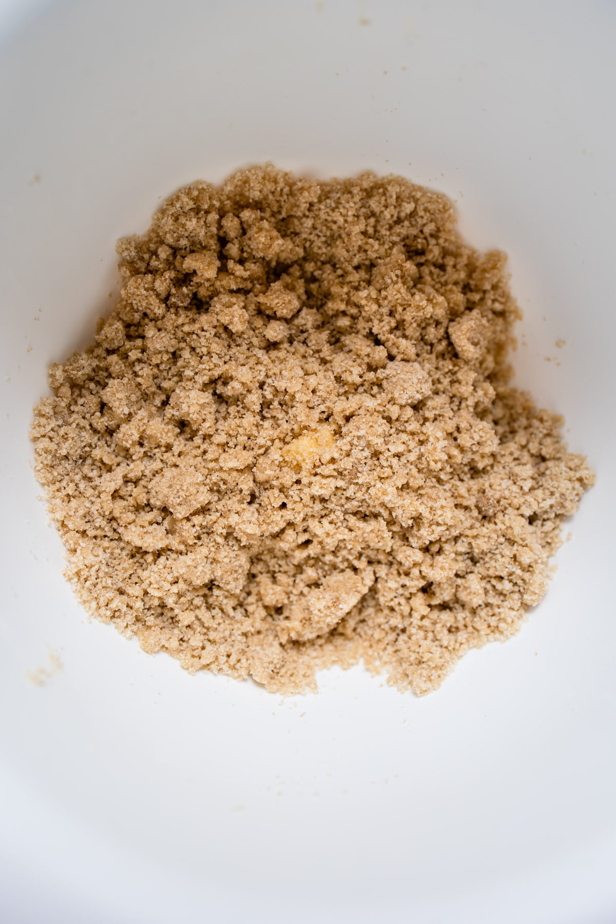 apple crumb pie topping in a mixing bowl.