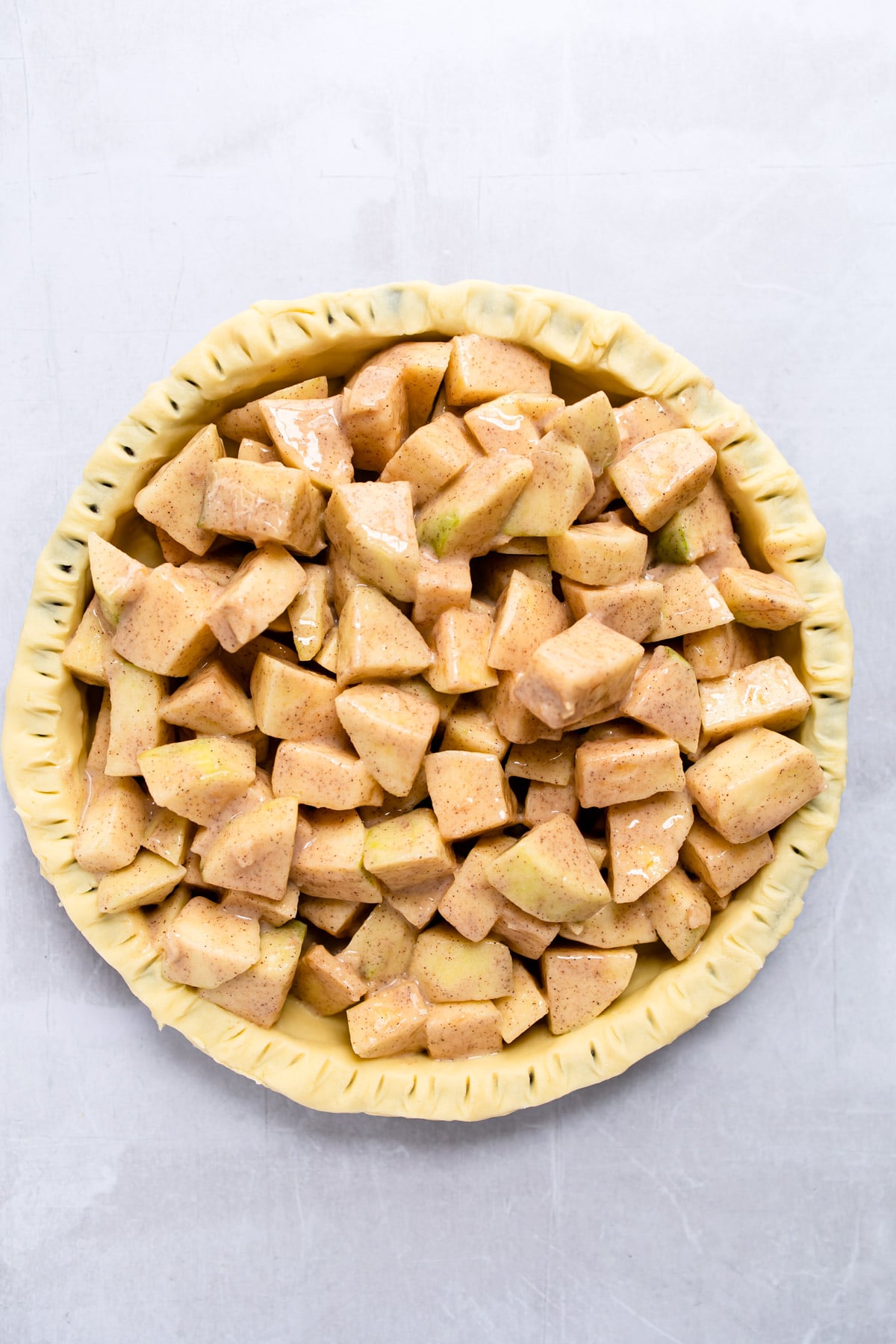 apple pie filling in an unbaked pie crust.