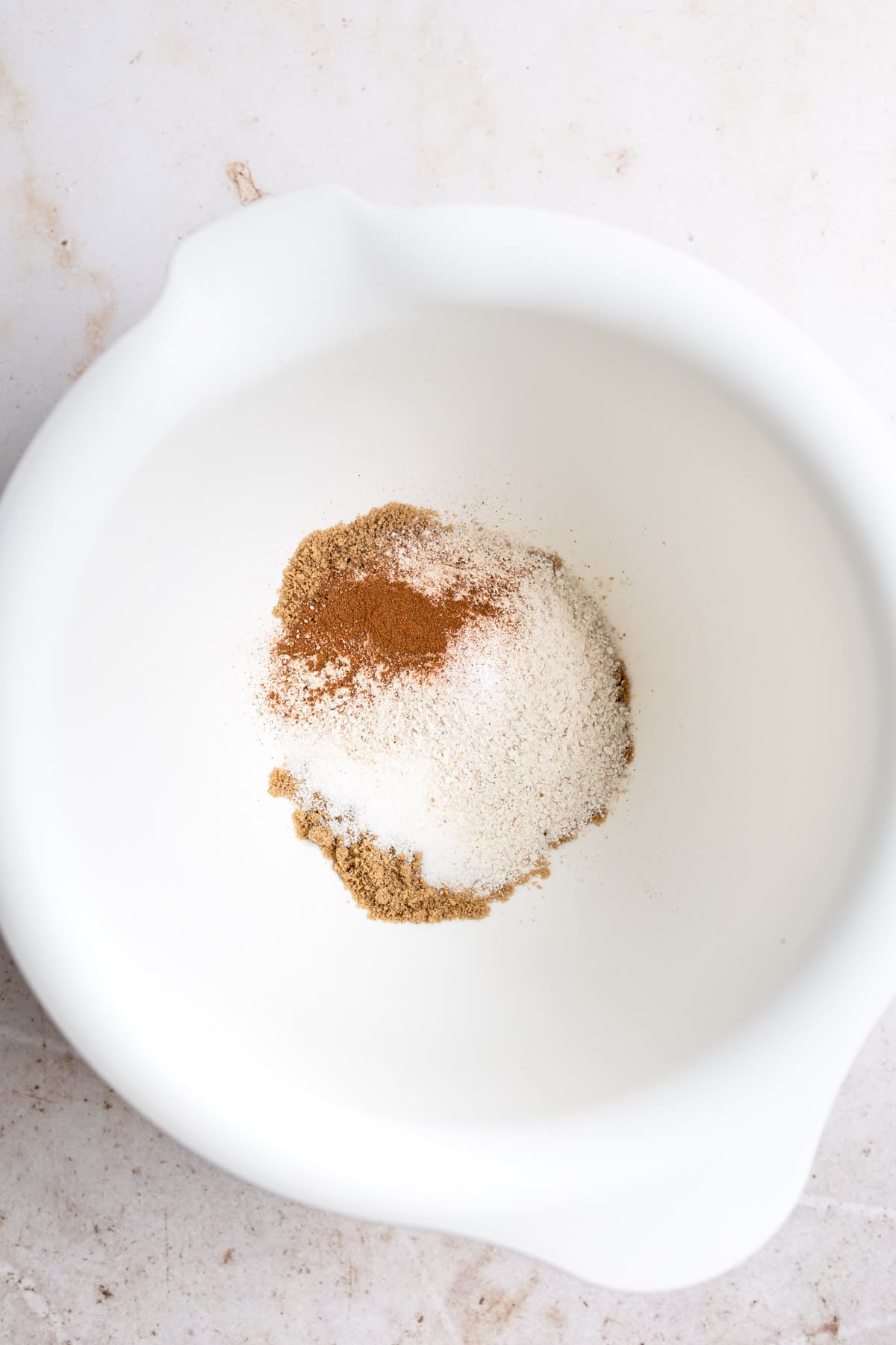 Ingredients for crisp topping in a white mixing bowl. 