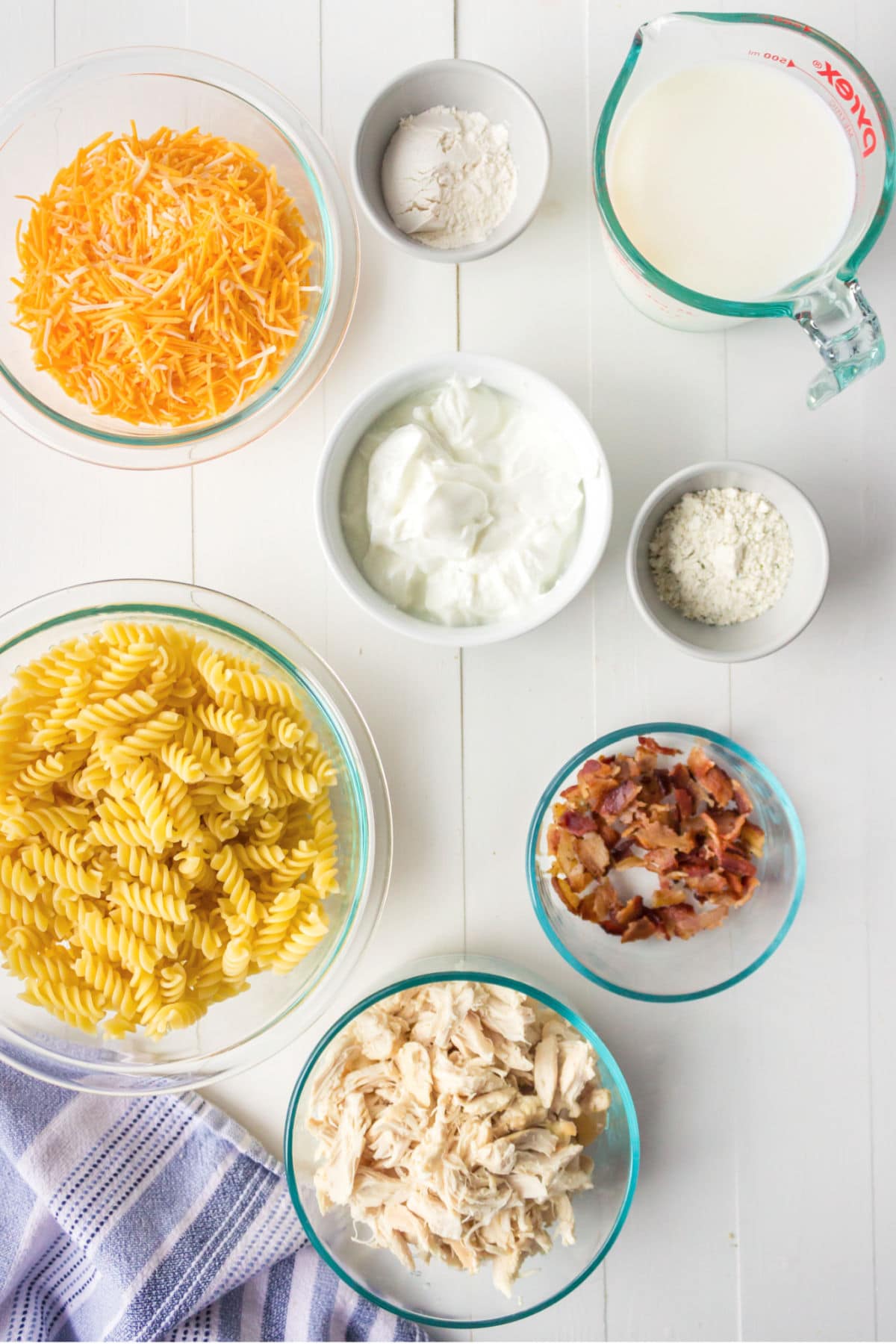 Ingredients for chicken bacon ranch pasta in bowls.