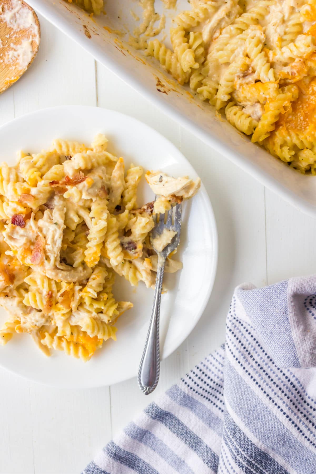 Chicken Bacon Ranch Pasta Bake Plate of chicken bacon ranch pasta next to a pan of pasta.