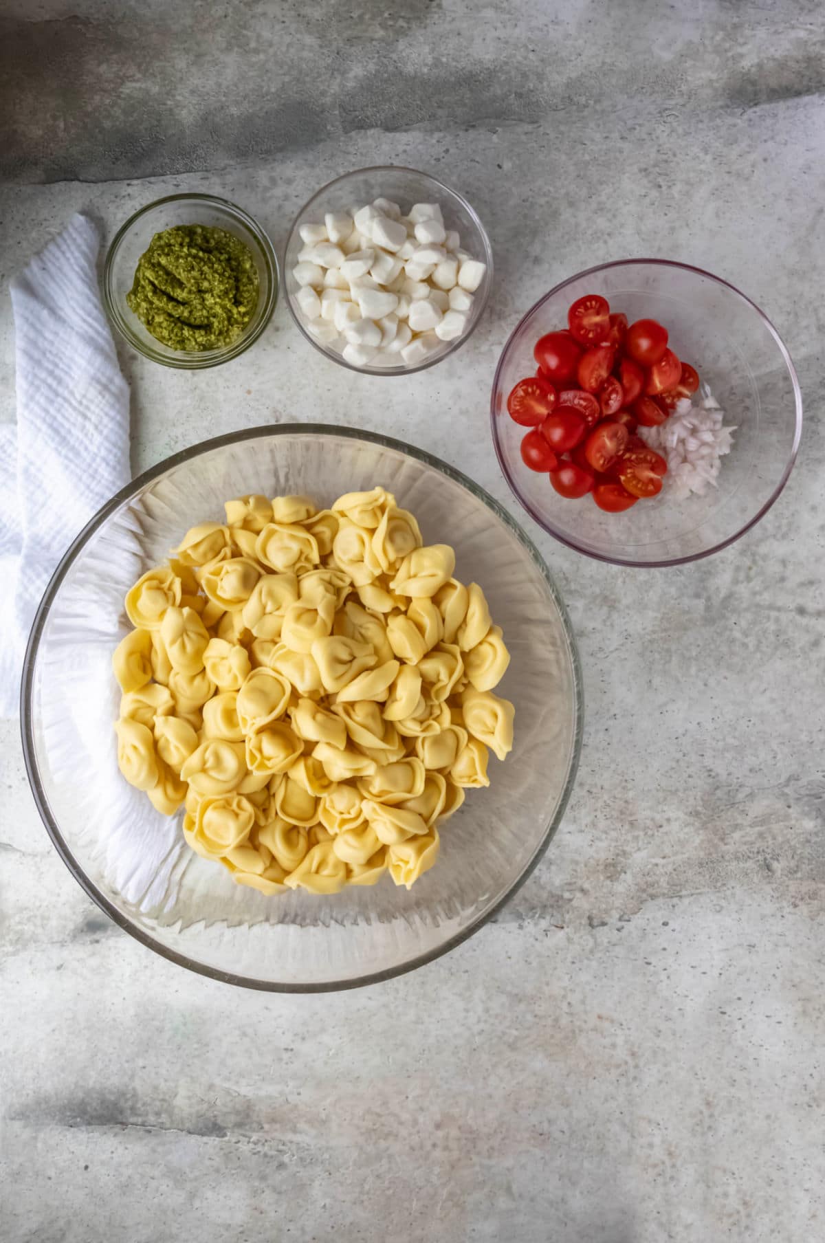 Fresh tortellini in a glass mixing bowl.