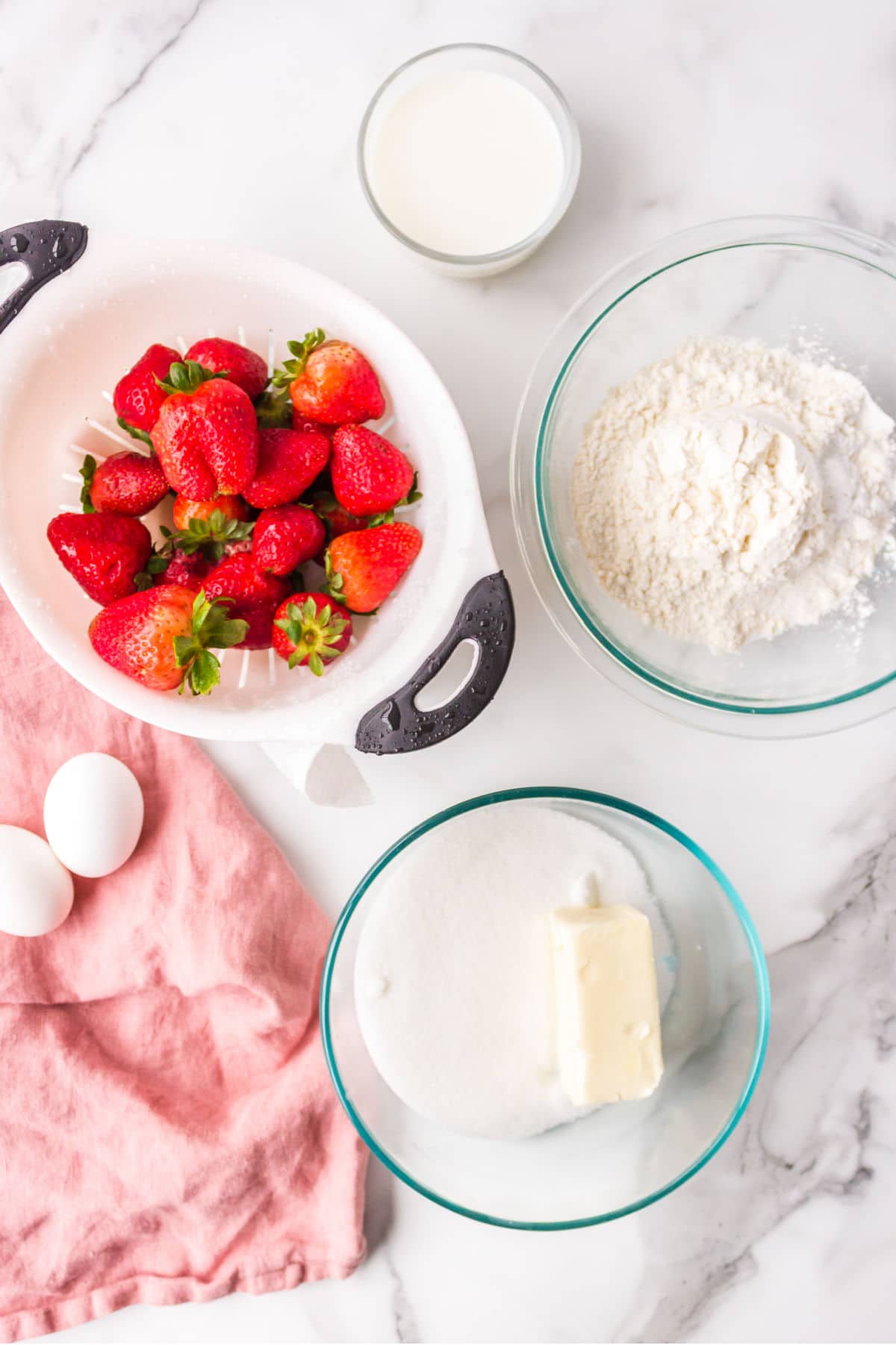 Ingredients for strawberry shortcake bars in bowls.