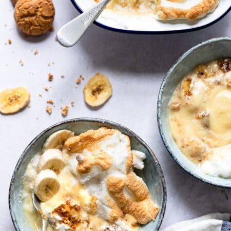 Dish of banana pudding with a spoon in it.