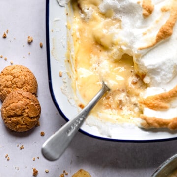 Pan of old-fashioned banana pudding with a spoon in it.