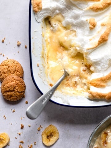 Pan of old-fashioned banana pudding with a spoon in it.