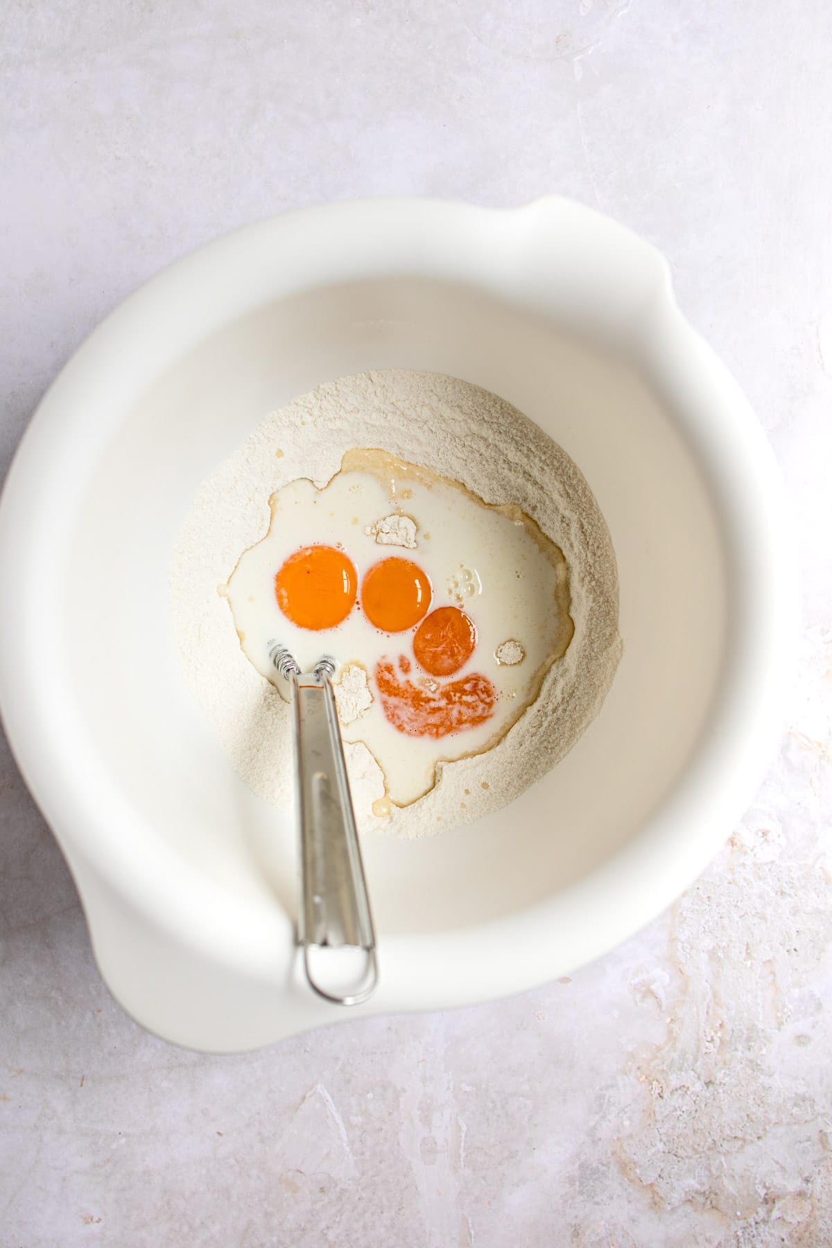 Egg yolks and flour in a saucepan.