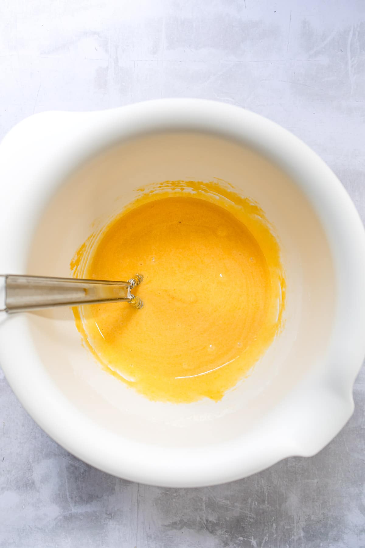 Flour and egg yolk mixture in a mixing bowl. 