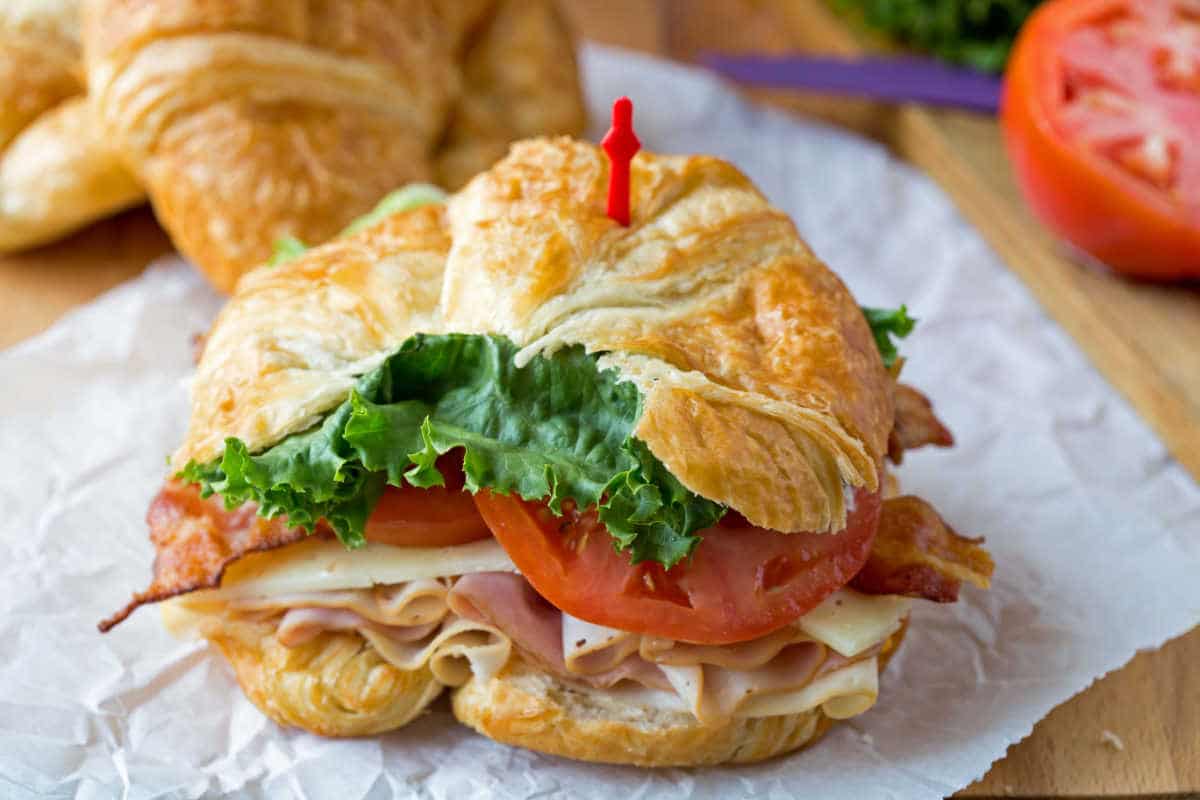 California club croissant with a toothpick in it. 