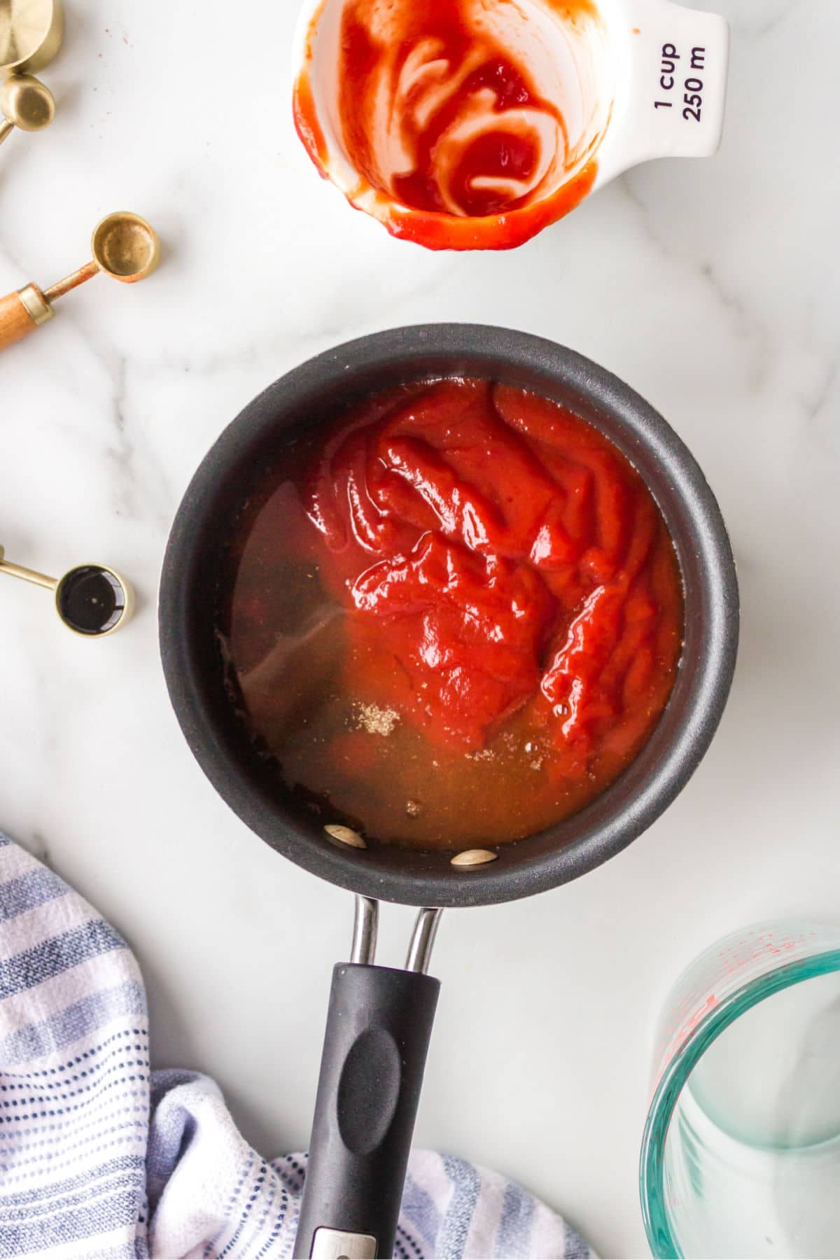 Barbecue sauce ingredients in a saucepan.