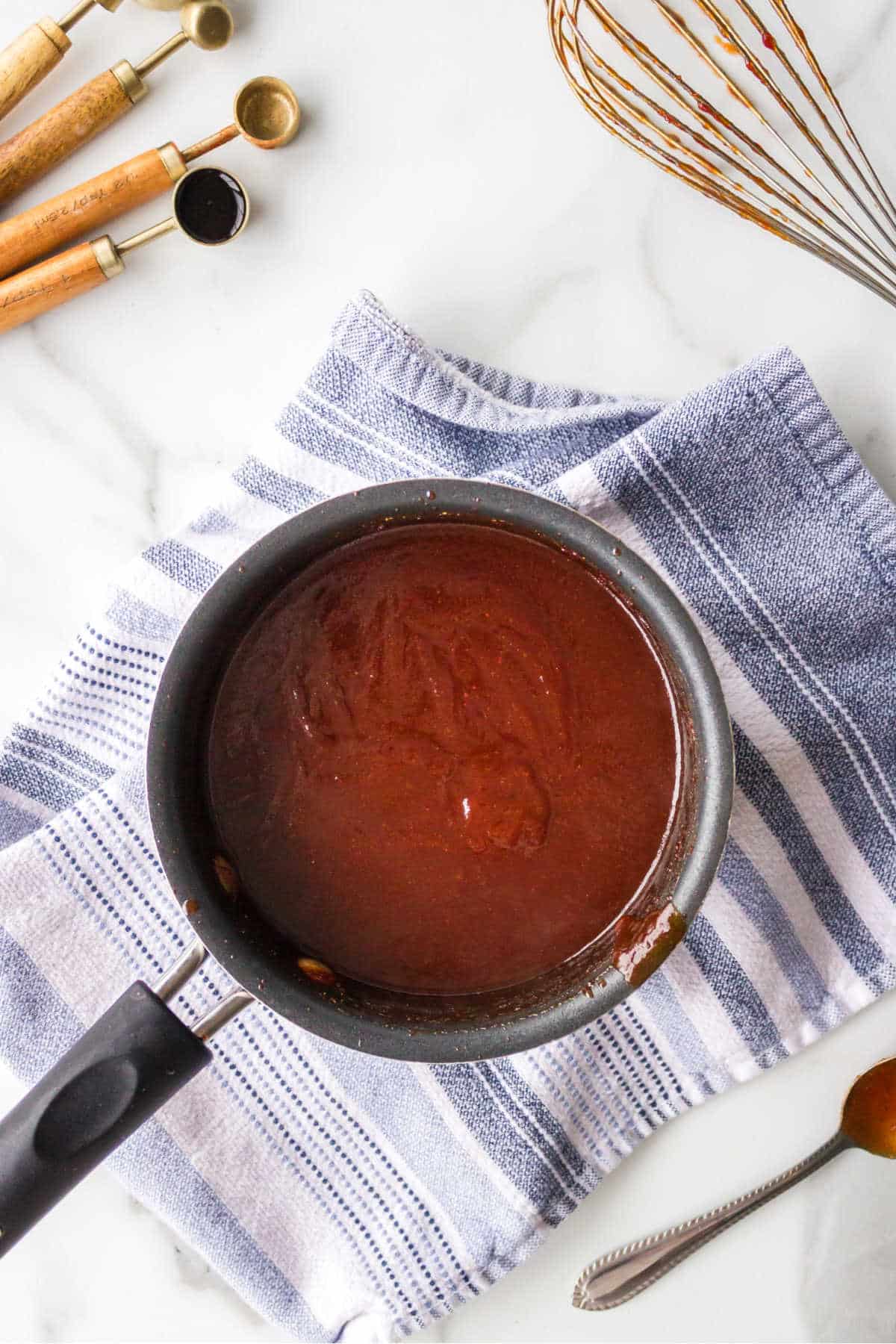 Cooked barbecue sauce in a saucepan.