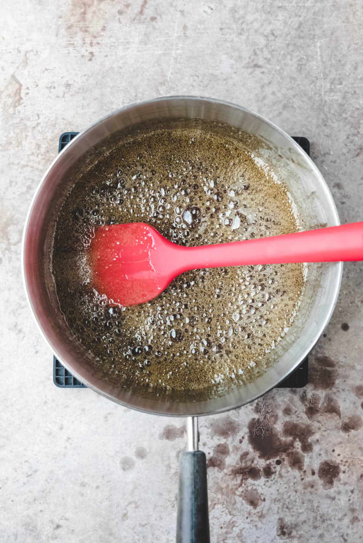 Boiling corn syrup and brown sugar in a saucepan.