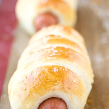 Homemade pretzel Dogs on a silicone baking mat.