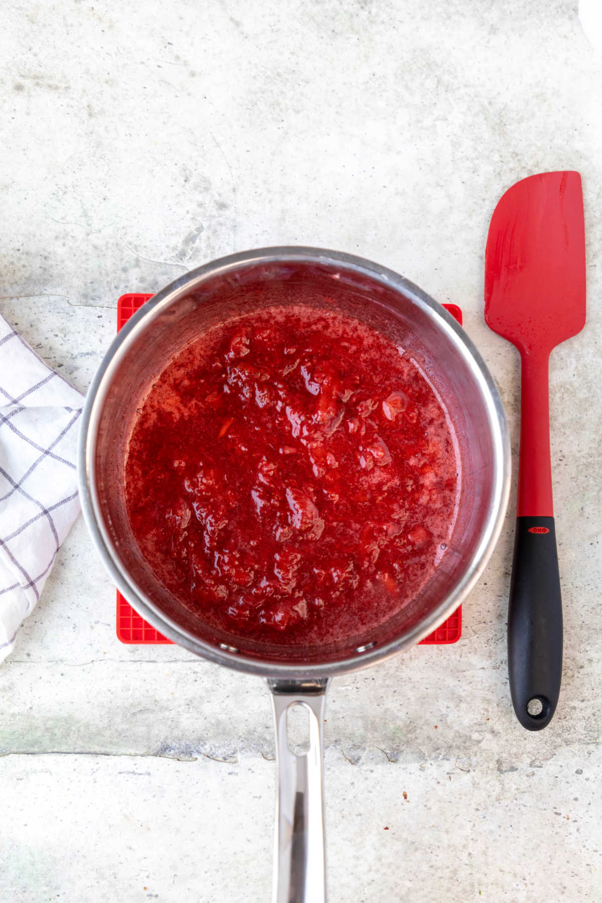 Strawberry sauce in a saucepan.