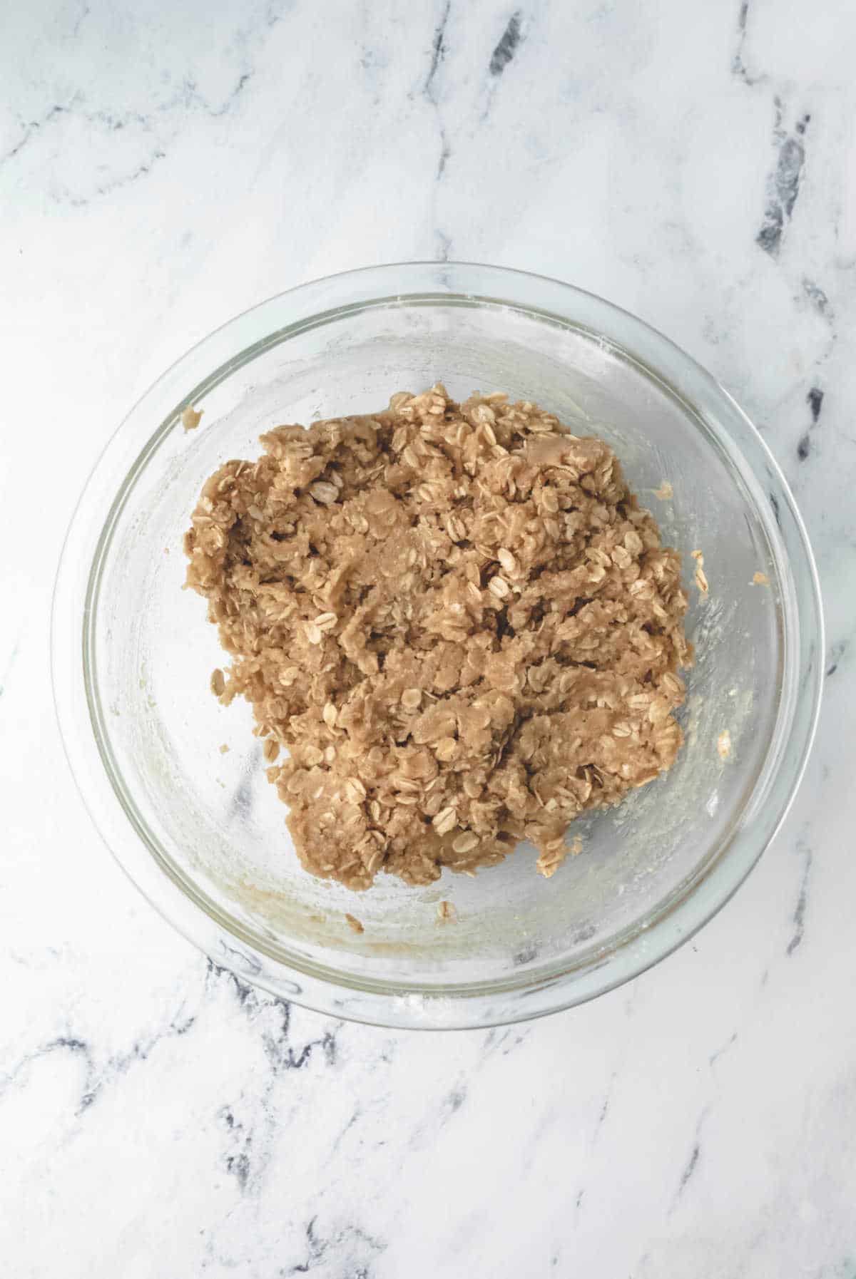 Crisp topping in a glass mixing bowl.