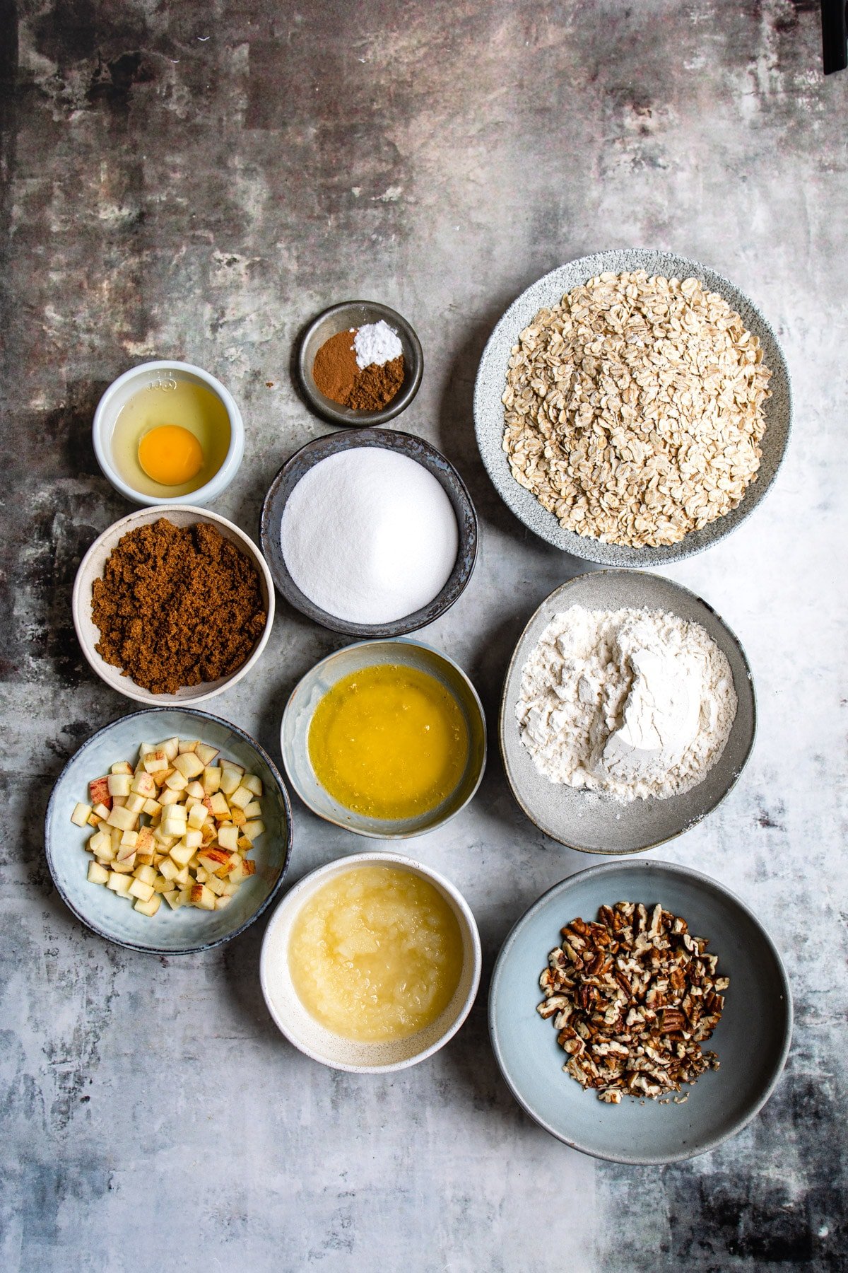 Ingredients for apple crisp cookies in dishes. 