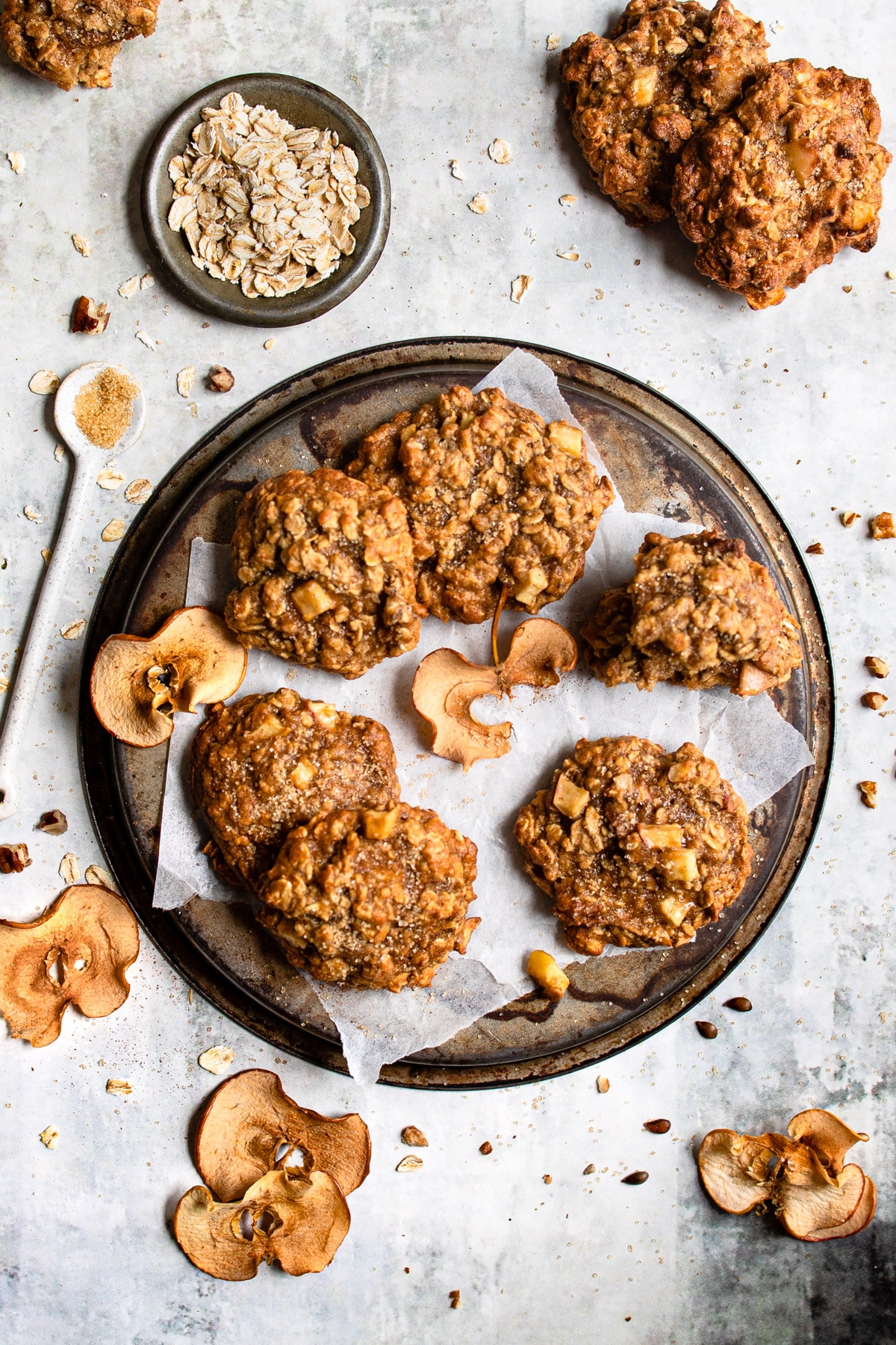 Tray of apple crisp cookies next to ingredients. 