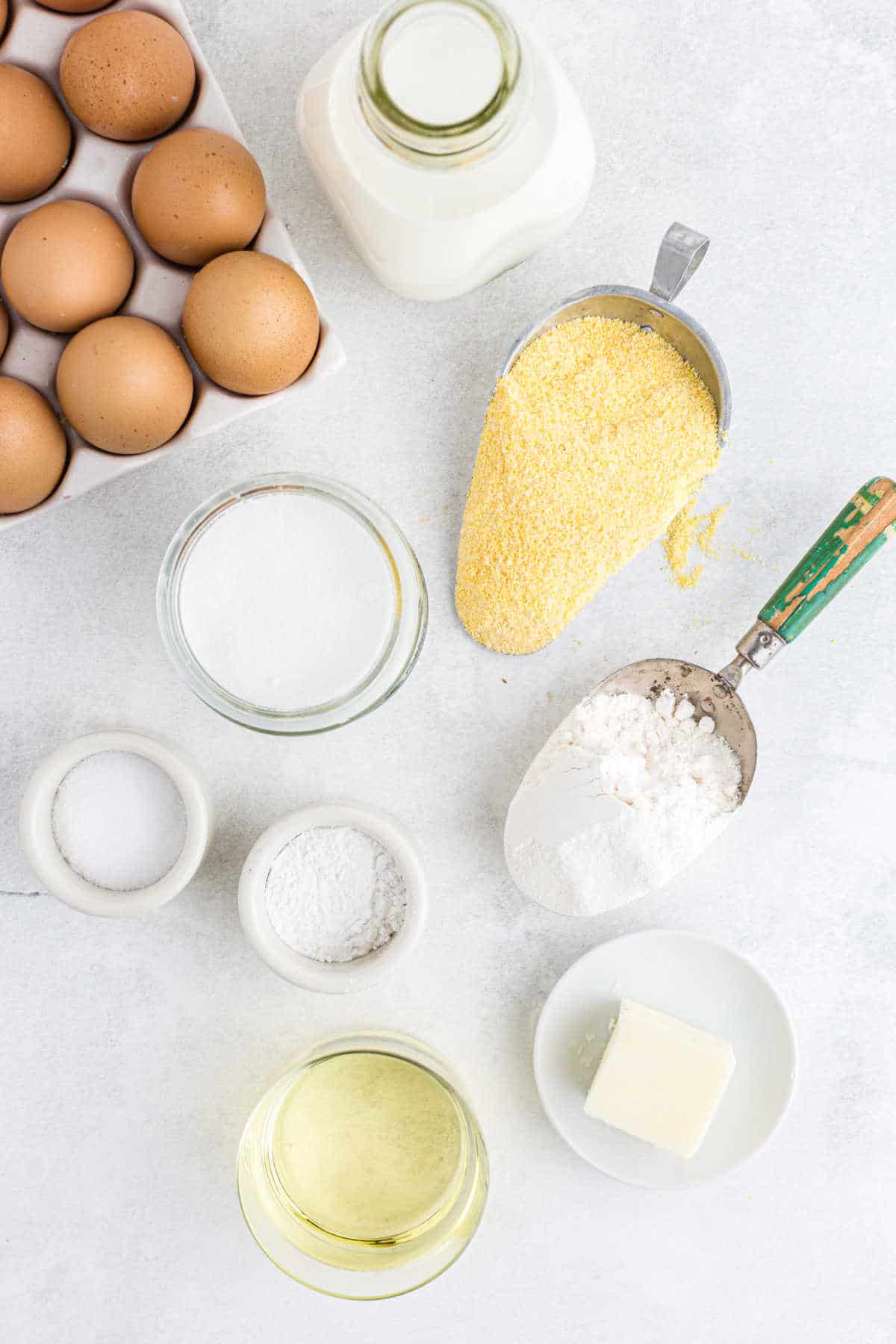 Ingredients for cornbread muffins in dishes. 