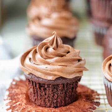 Swirl of chocolate cream cheese frosting on a chocolate cupcake.