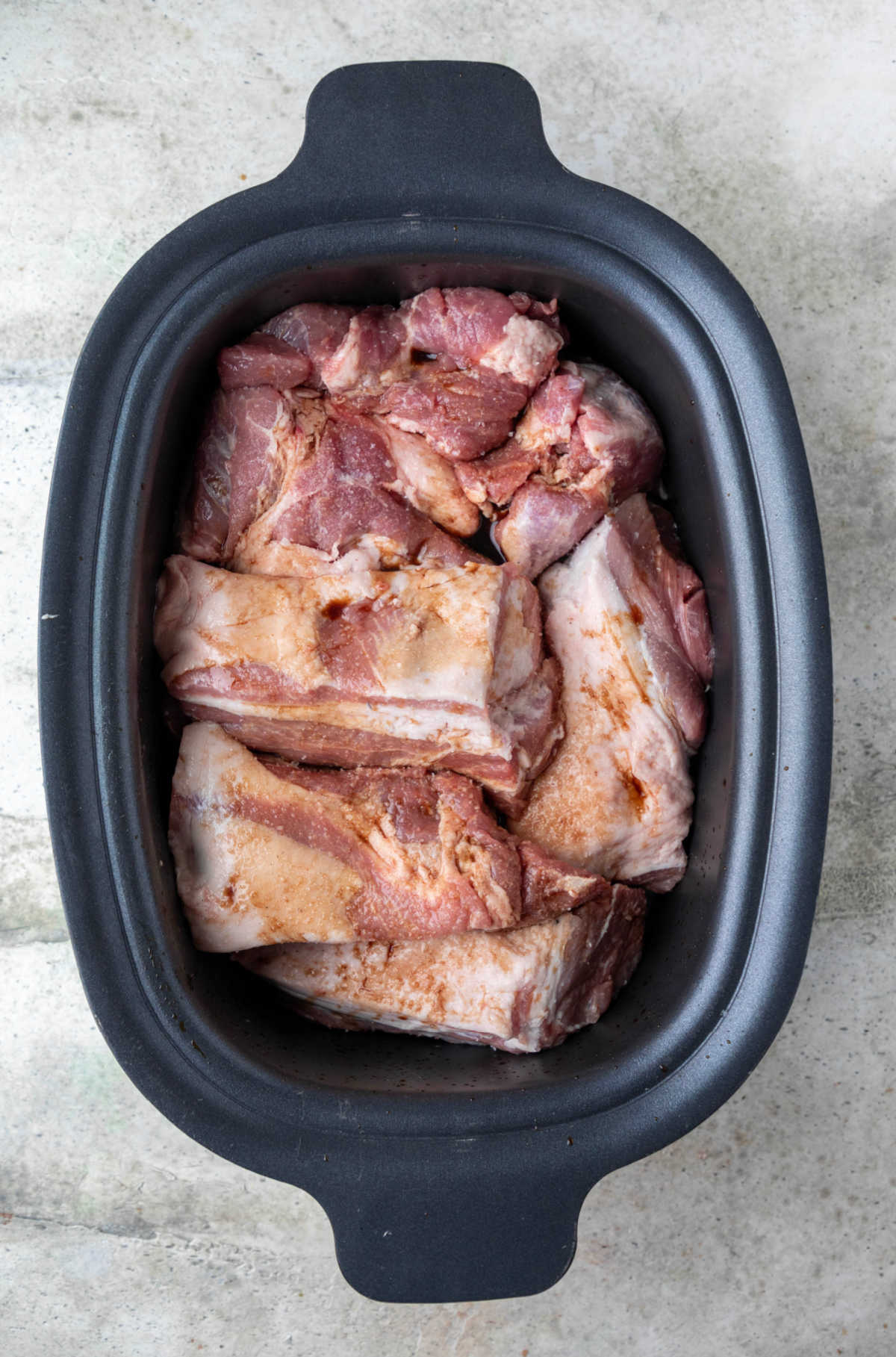 Pieces of pork coated with liquid smoke and sea salt. 