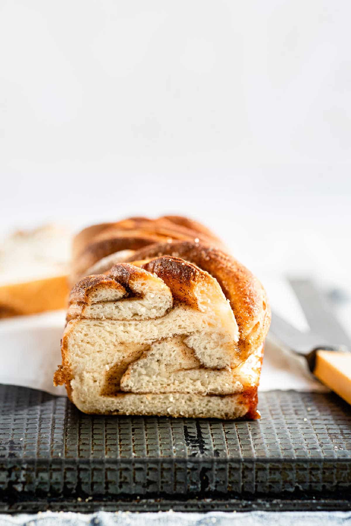 A loaf cinnamon twist bread with the end cut off 