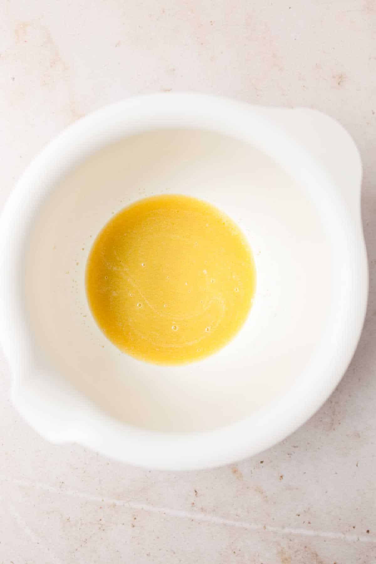 Melted butter and milk in a large mixing bowl. 