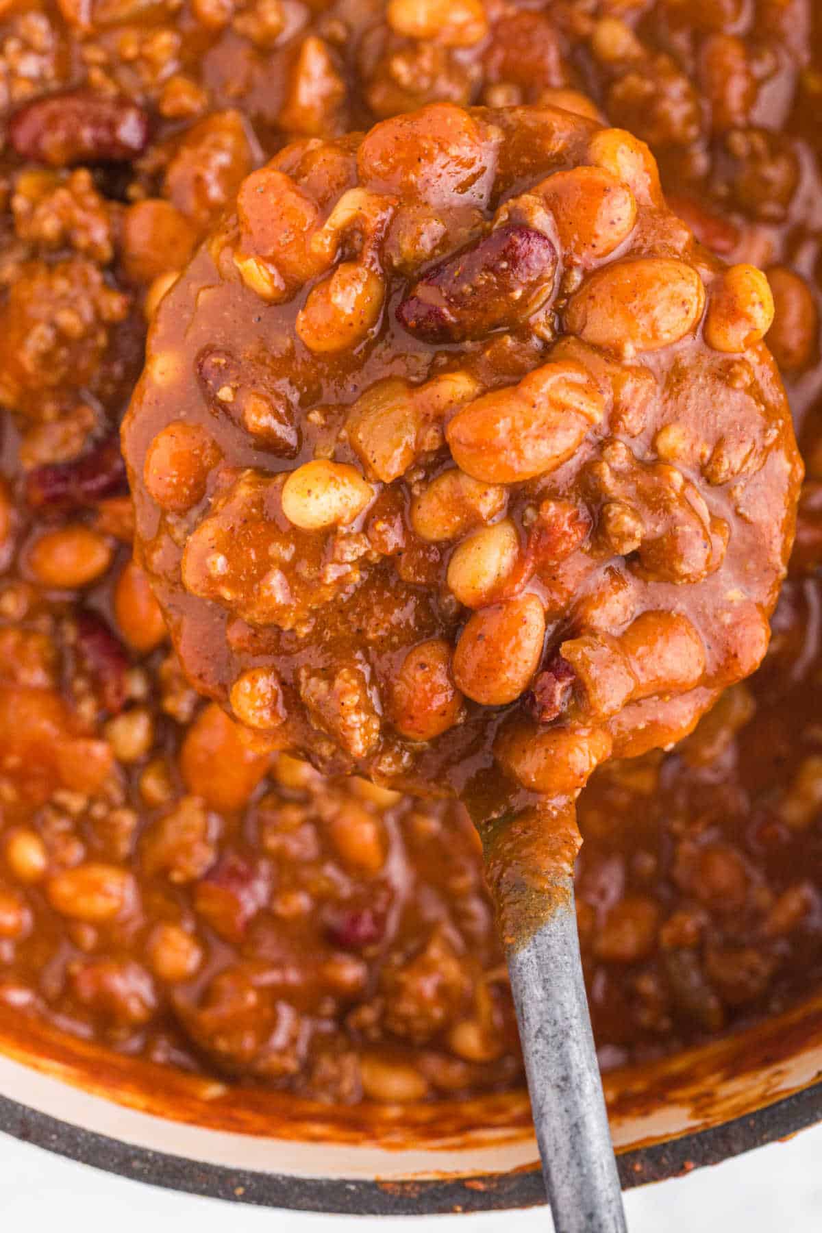 Close up photo of chili on a spoon. 